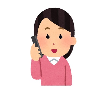 スマホで振袖の下見の予約電話をするお客様